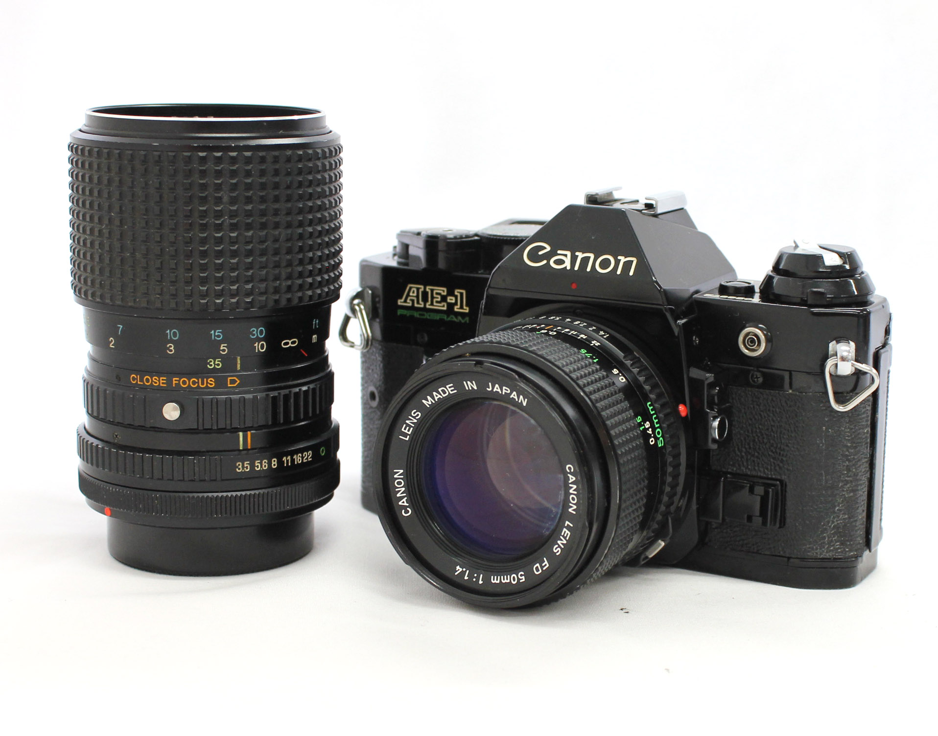 Japan Used Camera Shop | Canon AE-1 Program 35mm SLR Film Camera Black with 35-105mm F/3.5-4.3 & Bonus Lens 50mm F1.4 from Japan