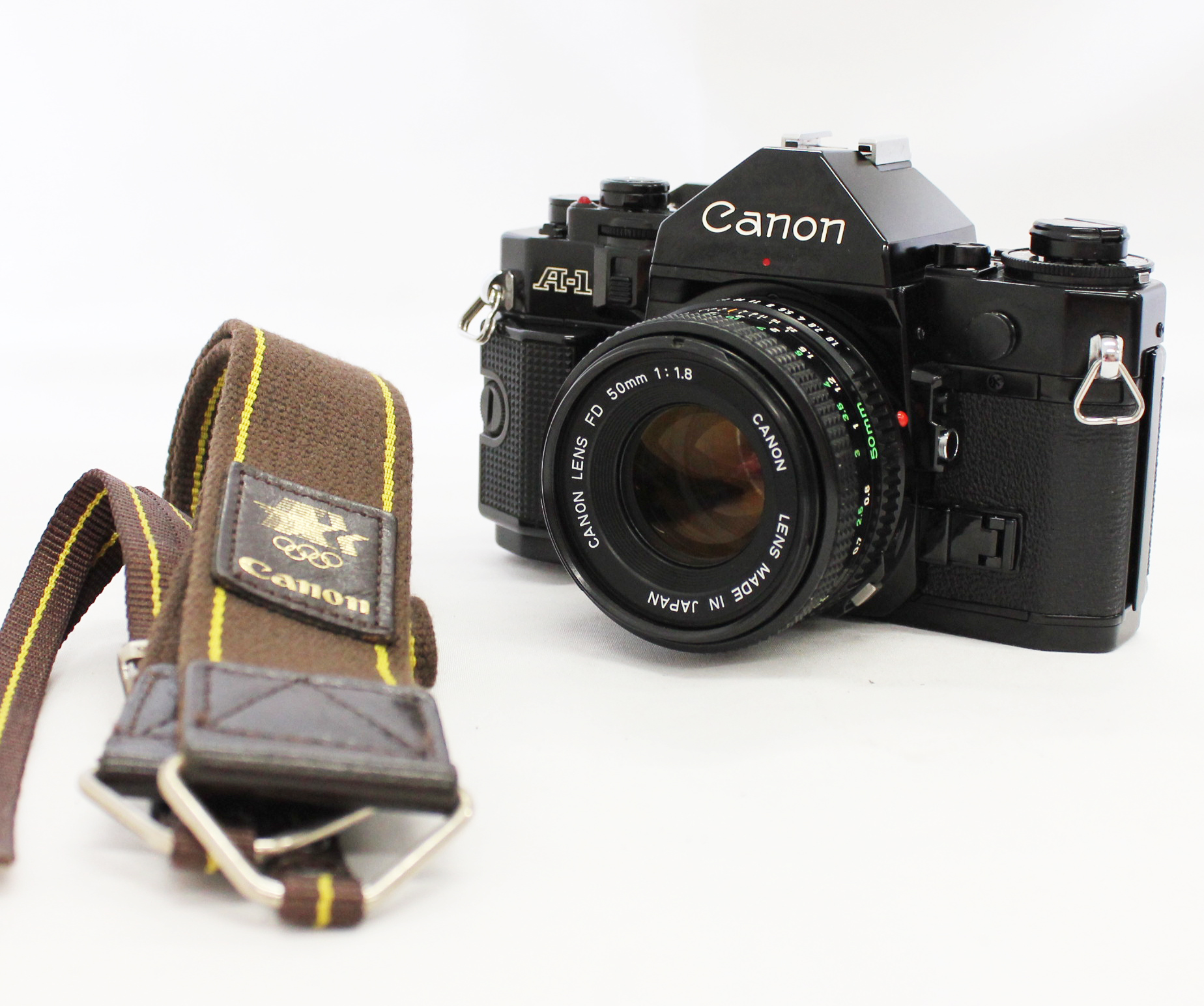 Japan Used Camera Shop | [Ex+++++] Canon A-1 Black 35mm SLR with New FD 50mm F/1.8 Lens and Olympic Strap from Japan