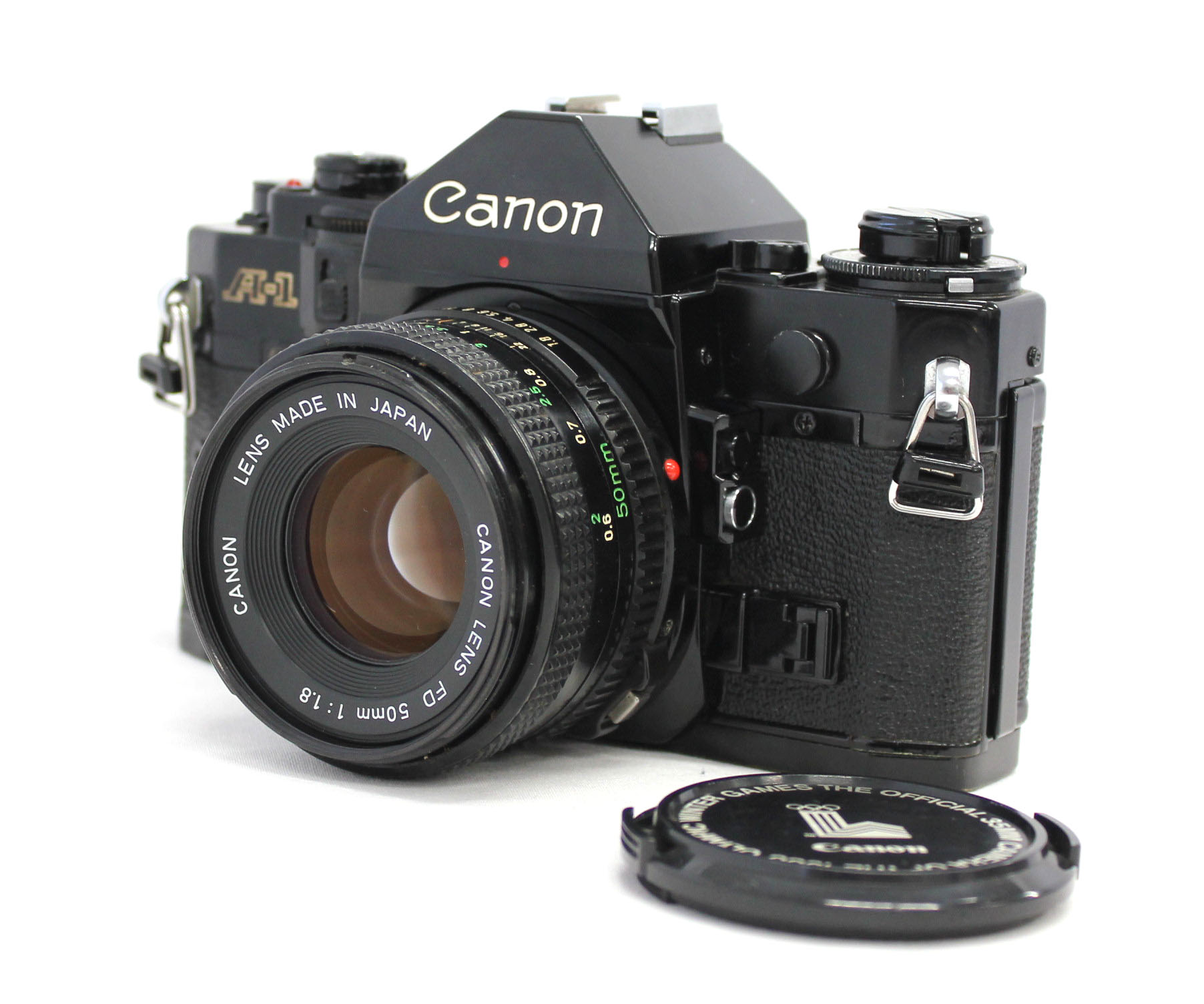 Japan Used Camera Shop | Canon A-1 35mm SLR Black with New FD 50mm F1.8 Lens & Olympic Cap from Japan